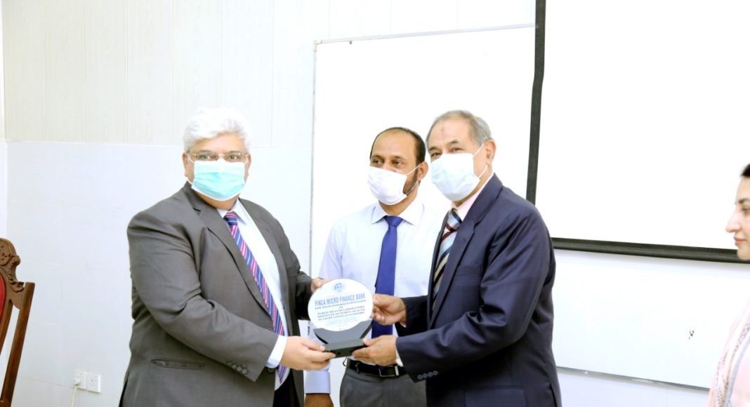 FINCA donates to IPH - Mubashar Bashir, CFO, FINCA Pakistan, receiving appreciation shield from The Chairman Board of Management, Institute of Public Health, Lt. Gen. (Rtd.) Khalid Maqbool