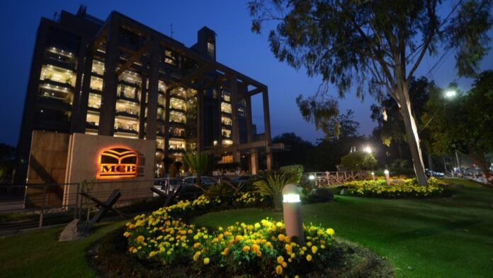 a building with a garden and flowers