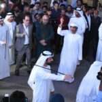 a group of men in white robes